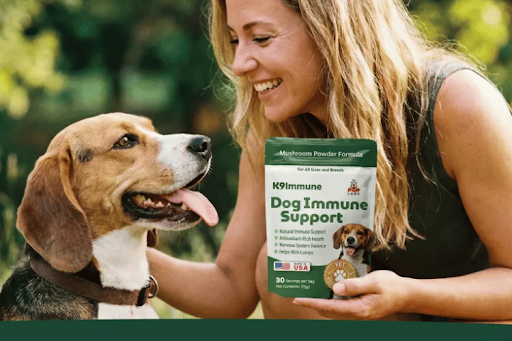 Woman holding K9 Immune Dog Immune Support supplement while interacting with her dog, highlighting daily immune support, healthy immune function, and overall wellness.